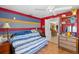Bright bedroom with unique wall details and connecting access to an adjacent room at 4279 Harbor Blvd, Port Charlotte, FL 33952
