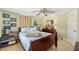 Well-lit bedroom showcasing a comfortable bed, decorative pillows, and ample closet space at 4279 Harbor Blvd, Port Charlotte, FL 33952