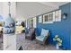 Cozy front porch with comfortable seating and bright blue accents create a welcoming entrance at 4279 Harbor Blvd, Port Charlotte, FL 33952