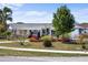 Charming home with a well-maintained front yard, colorful landscaping, and a welcoming entrance at 4279 Harbor Blvd, Port Charlotte, FL 33952