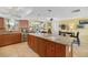 Spacious kitchen featuring a large center island, stainless steel appliances, and wood cabinetry at 4279 Harbor Blvd, Port Charlotte, FL 33952