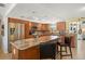 Spacious kitchen featuring modern appliances, an island with seating, and tiled flooring at 4279 Harbor Blvd, Port Charlotte, FL 33952