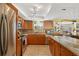 Well-lit kitchen featuring stainless steel appliances, tile floors, and ample cabinet space at 4279 Harbor Blvd, Port Charlotte, FL 33952