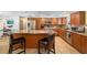Spacious kitchen features an island with seating, stainless steel appliances, and ample cabinet space at 4279 Harbor Blvd, Port Charlotte, FL 33952