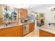 Bright kitchen with natural light, stainless steel appliances, and classic countertops at 4279 Harbor Blvd, Port Charlotte, FL 33952