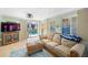 Comfortable living room with pool view, and neutral tones, creating a relaxing atmosphere at 4279 Harbor Blvd, Port Charlotte, FL 33952