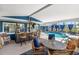 Covered patio featuring a pool, outdoor seating, and a bar, ideal for relaxation at 4279 Harbor Blvd, Port Charlotte, FL 33952