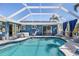 Inviting pool featuring a screened enclosure, hot tub, and outdoor patio area at 4279 Harbor Blvd, Port Charlotte, FL 33952