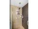 Modern tiled shower with adjustable shower head and convenient storage shelves at 4279 Harbor Blvd, Port Charlotte, FL 33952