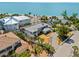 Breathtaking aerial view of a coastal home, lush landscaping, and serene beach access at 6112 Gnarled Oak Dr, Englewood, FL 34223