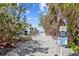 Private sandy path leading to a secluded beach at 6112 Gnarled Oak Dr, Englewood, FL 34223