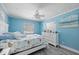 Bright bedroom with marine-themed decor, and natural light at 6112 Gnarled Oak Dr, Englewood, FL 34223