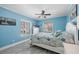 Comfortable bedroom with coastal decor and a window view at 6112 Gnarled Oak Dr, Englewood, FL 34223