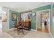 Charming dining area featuring a small table, accent rug, and beachy décor, adjacent to the bar area at 6112 Gnarled Oak Dr, Englewood, FL 34223