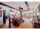 Kitchen and dining area featuring rustic wooden furniture and a decorative ceiling fan at 6112 Gnarled Oak Dr, Englewood, FL 34223