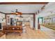 Warm dining room with natural wood finishes, connecting to the kitchen and living area at 6112 Gnarled Oak Dr, Englewood, FL 34223