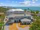 Stunning coastal home with meticulous landscaping and beach access, perfect for luxury waterfront living at 6112 Gnarled Oak Dr, Englewood, FL 34223