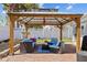 Beautiful brick patio with a cozy gazebo featuring comfortable seating and a charming backyard view at 6112 Gnarled Oak Dr, Englewood, FL 34223