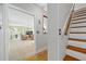 Hallway leading into living room featuring tile flooring and neutral walls at 6112 Gnarled Oak Dr, Englewood, FL 34223