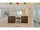 Yellow-toned main bathroom featuring dual vanities and a soaking tub at 6112 Gnarled Oak Dr, Englewood, FL 34223