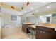 Beautiful yellow-toned main bathroom featuring dual vanities and a soaking tub at 6112 Gnarled Oak Dr, Englewood, FL 34223