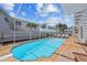 Beautiful outdoor pool area with a view at 6112 Gnarled Oak Dr, Englewood, FL 34223