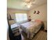 Bedroom with a comfortable bed, neutral decor, and lots of natural light at 715 Fairmount Dr, North Port, FL 34287