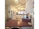 Cozy kitchen with white cabinets, stainless steel appliances, and breakfast bar at 715 Fairmount Dr, North Port, FL 34287