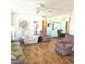 Bright living area features wood floors and easy access to dining room at 715 Fairmount Dr, North Port, FL 34287