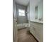 Bathroom with a shower/tub combo, white vanity, and a large mirror at 8136 Sweden Blvd, Punta Gorda, FL 33982