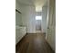Bathroom featuring wood-look tile flooring and a shower with gray tiled walls at 8136 Sweden Blvd, Punta Gorda, FL 33982