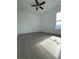 Bedroom featuring tile flooring, a ceiling fan, and natural light at 8136 Sweden Blvd, Punta Gorda, FL 33982