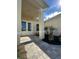 Welcoming entryway with a stone walkway, manicured garden beds, and a covered porch leading to double doors at 8136 Sweden Blvd, Punta Gorda, FL 33982