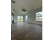Bright living room with tile flooring, plenty of natural light from windows, and a ceiling fan at 8136 Sweden Blvd, Punta Gorda, FL 33982