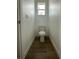 Powder room features wood look tile flooring and a window that lets in natural light at 8136 Sweden Blvd, Punta Gorda, FL 33982