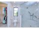 Bathroom with glass shower, toilet, window, and closet area at 815 Via Formia, Punta Gorda, FL 33950