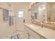 Bathroom with a shell-framed mirror and beachy accessories at 815 Via Formia, Punta Gorda, FL 33950