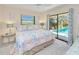 Bedroom with a pool view, providing a relaxing atmosphere at 815 Via Formia, Punta Gorda, FL 33950