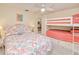 Charming bedroom with a bunk bed and views through the doorway at 815 Via Formia, Punta Gorda, FL 33950