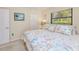 Bedroom with a window, a closet and coastal-themed accents at 815 Via Formia, Punta Gorda, FL 33950