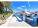 Private dock with a boat lift, making it easy to enjoy boating and water activities right from your backyard at 815 Via Formia, Punta Gorda, FL 33950