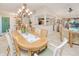 Open concept dining room area with views into the entry, kitchen, living room, and pool area at 815 Via Formia, Punta Gorda, FL 33950