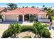 Inviting single story home with a Spanish tile roof, beautiful landscaping, and a two car garage at 815 Via Formia, Punta Gorda, FL 33950