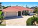 Beautiful one story home with spanish tile roof, two car garage, and well manicured landscaping at 815 Via Formia, Punta Gorda, FL 33950
