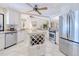 Updated kitchen features stainless steel appliances, granite countertops, and center island with wine rack at 815 Via Formia, Punta Gorda, FL 33950