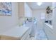 Functional laundry room with modern appliances and ample counter space at 815 Via Formia, Punta Gorda, FL 33950