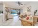 Comfortable living room with tiled floors and sliding glass doors to the patio and pool at 815 Via Formia, Punta Gorda, FL 33950