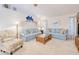 Comfortable living room featuring vaulted ceilings, plush seating, and stylish coastal decor for a relaxed ambiance at 815 Via Formia, Punta Gorda, FL 33950