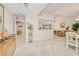 Open concept living space with tile floors, neutral paint, and views into the dining and living rooms at 815 Via Formia, Punta Gorda, FL 33950