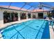 Relax in this outdoor pool featuring a cage and a serene outdoor living space for enjoying the Florida sunshine at 815 Via Formia, Punta Gorda, FL 33950